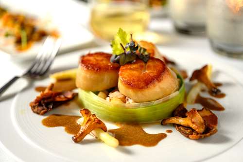 Smoked scallops, salpicon of white asparagus & lobster, Iberico chorizo chips, lobster sauce
